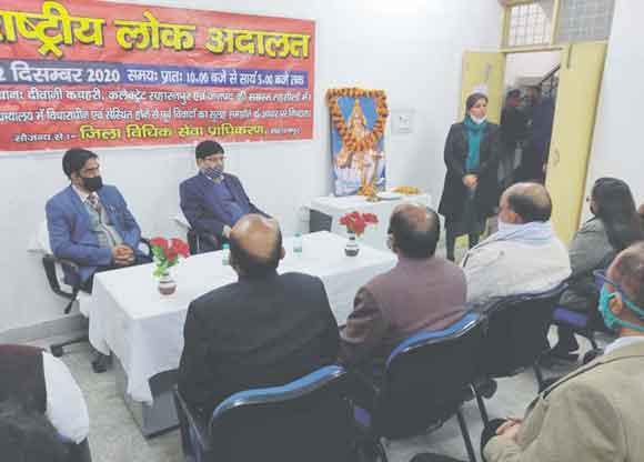 राष्ट्रीय लोक अदालत में किया 7065 वादों निस्तारण