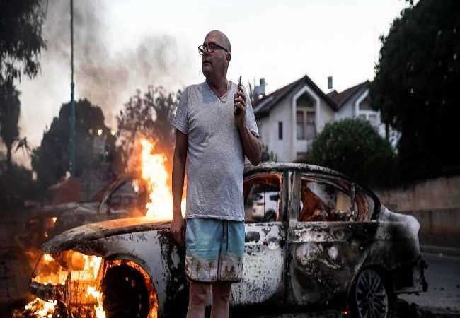 Israeli–Palestinian conflict: इजरायल के कुछ शहरों में भड़के दंगे, गाजा में 83 की मौत, जानें- हमास के हमले का कारण